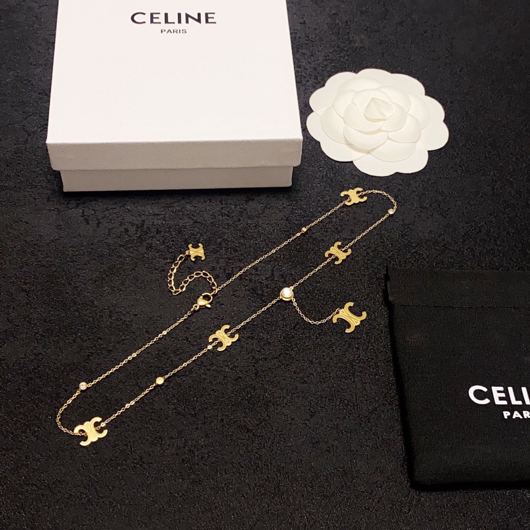 Celine Triomphe Multi-Logo Lariat necklace 14K gold-toned metal with clear cubic zirconia accents 45cm with 5cm extender