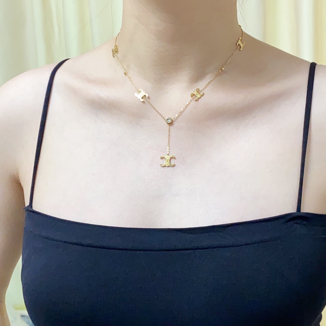 Celine Triomphe Multi-Logo Lariat necklace 14K gold-toned metal with clear cubic zirconia accents 45cm with 5cm extender