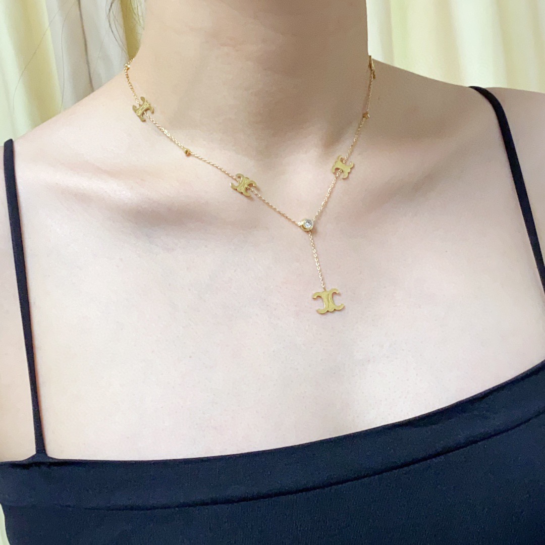 Celine Triomphe Multi-Logo Lariat necklace 14K gold-toned metal with clear cubic zirconia accents 45cm with 5cm extender