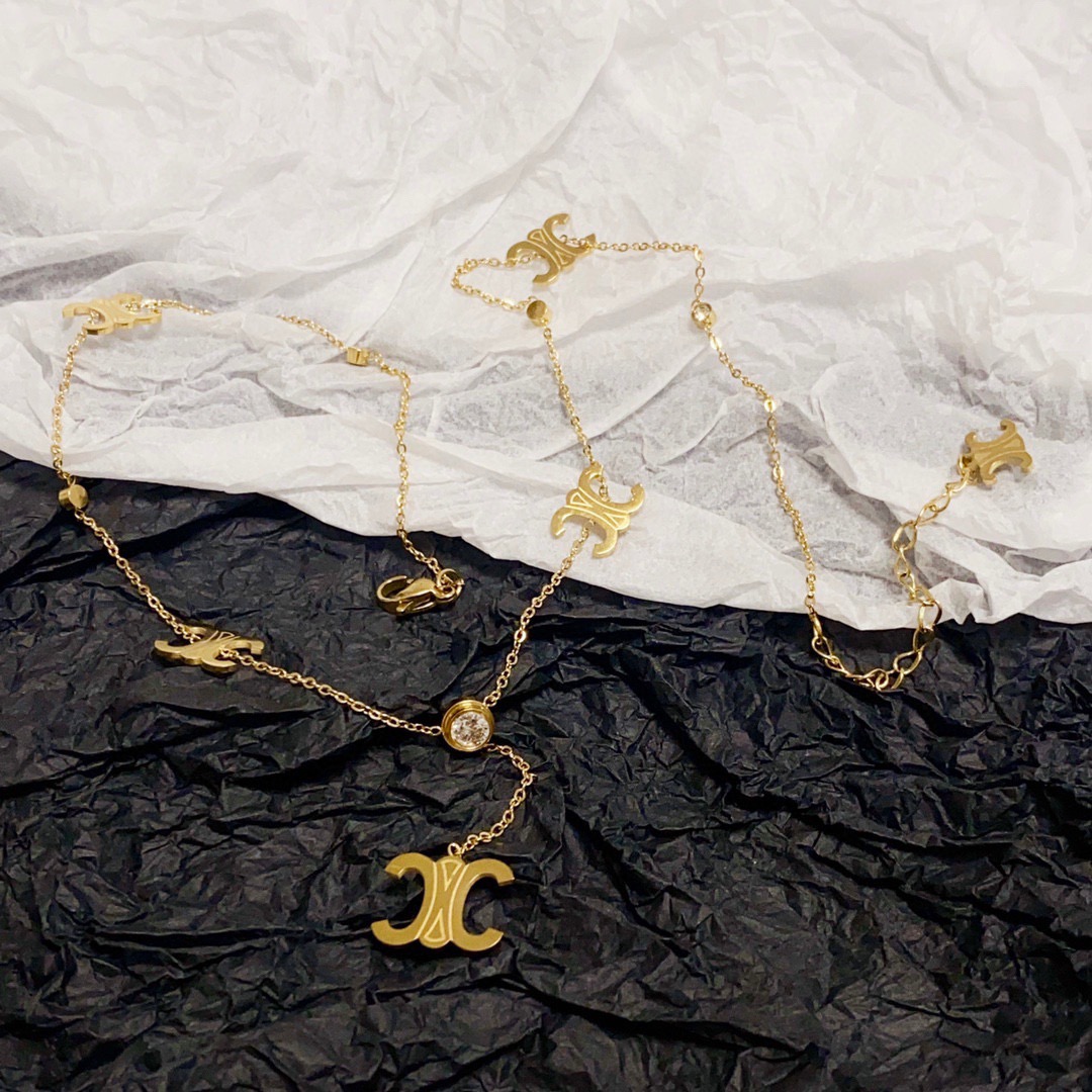 Celine Triomphe Multi-Logo Lariat necklace 14K gold-toned metal with clear cubic zirconia accents 45cm with 5cm extender