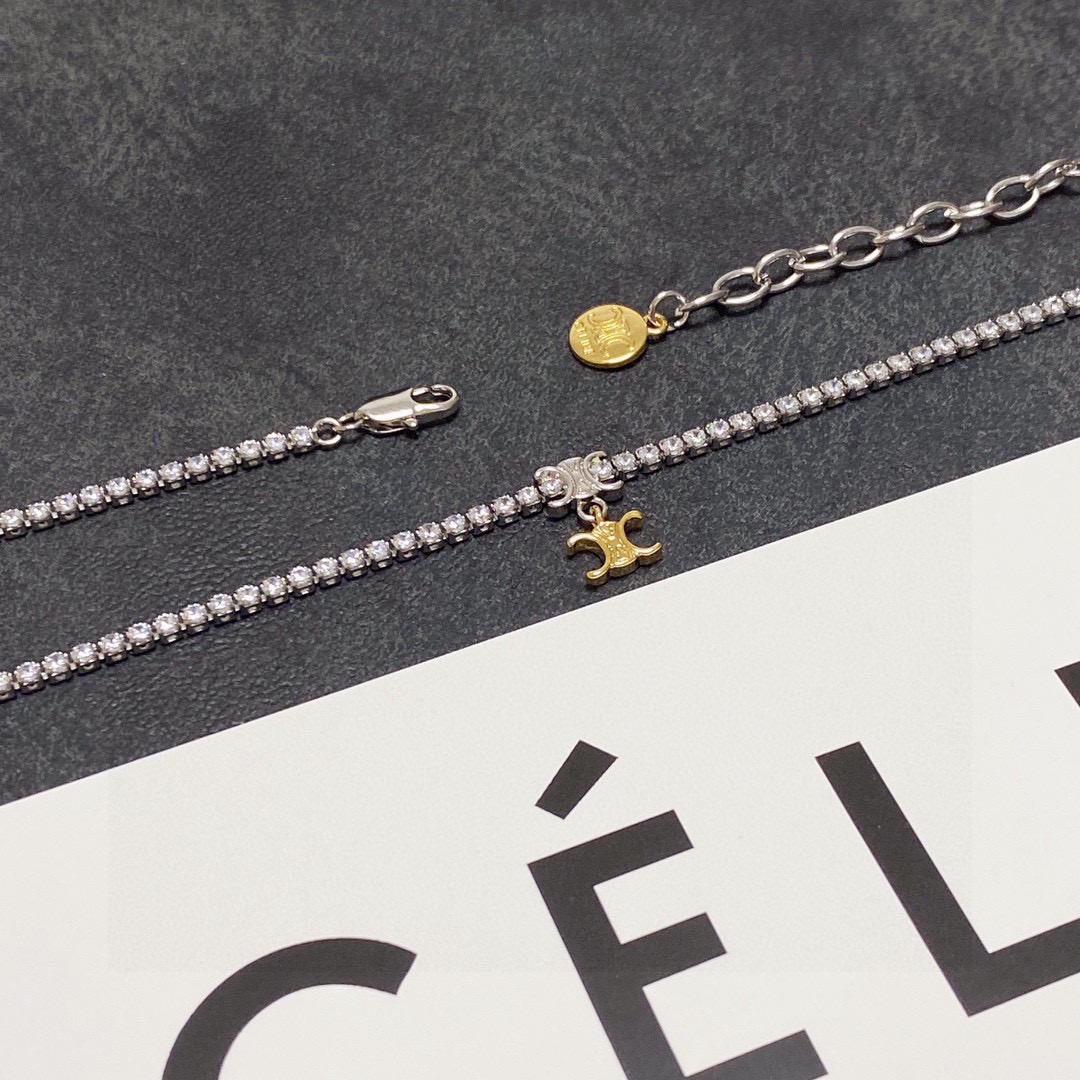 Celine Triomphe necklace silver-toned metal with clear cubic zirconia gold-toned Triomphe charm 38cm
