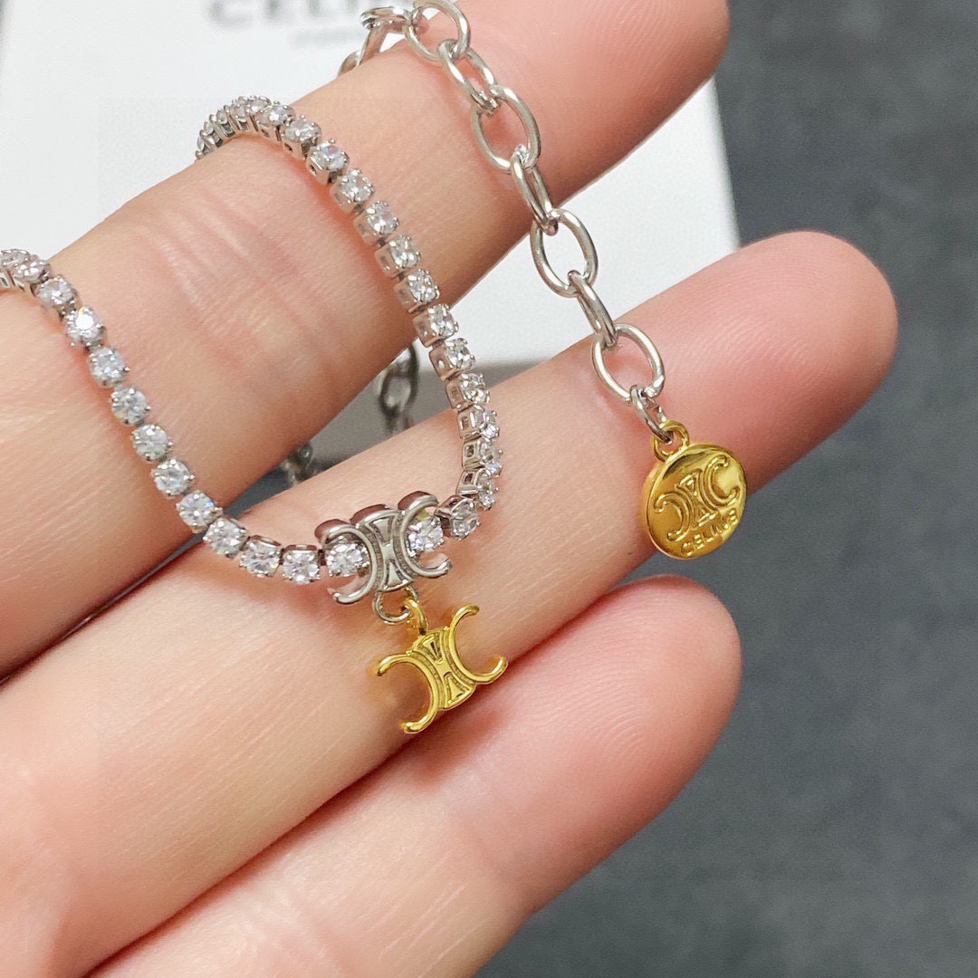 Celine Triomphe necklace silver-toned metal with clear cubic zirconia gold-toned Triomphe charm 38cm