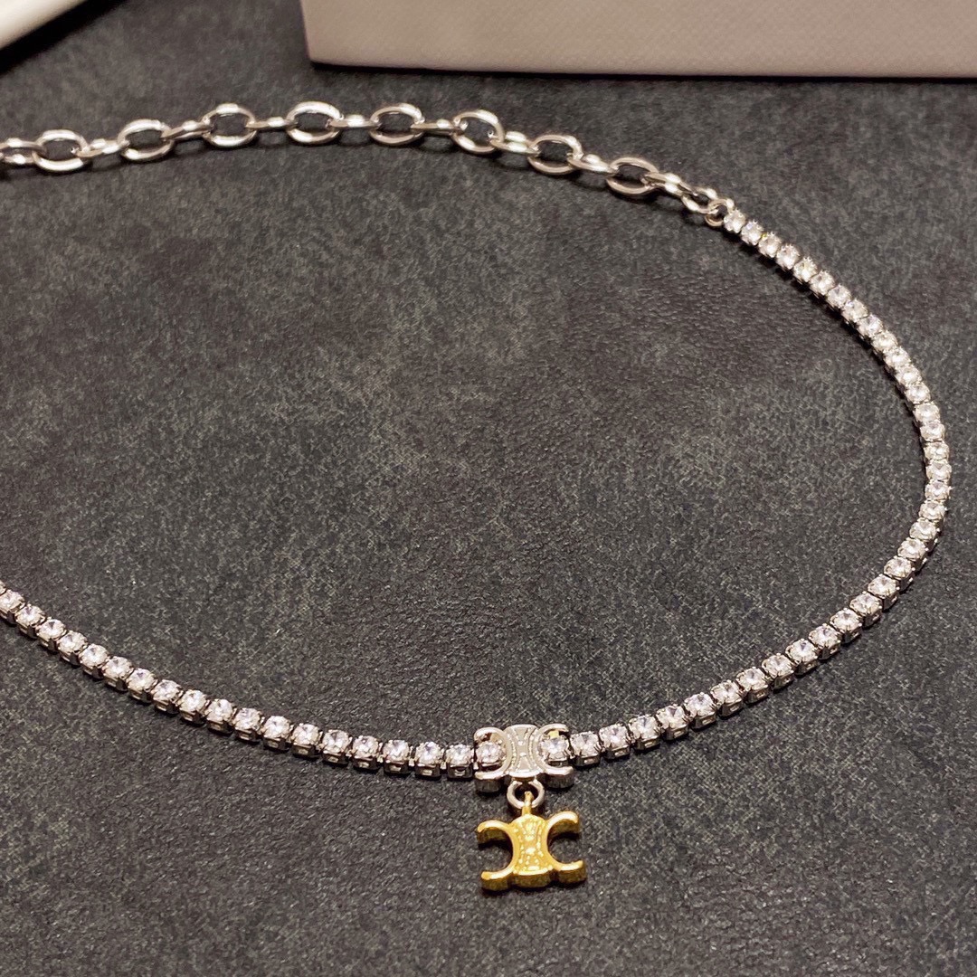 Celine Triomphe necklace silver-toned metal with clear cubic zirconia gold-toned Triomphe charm 38cm
