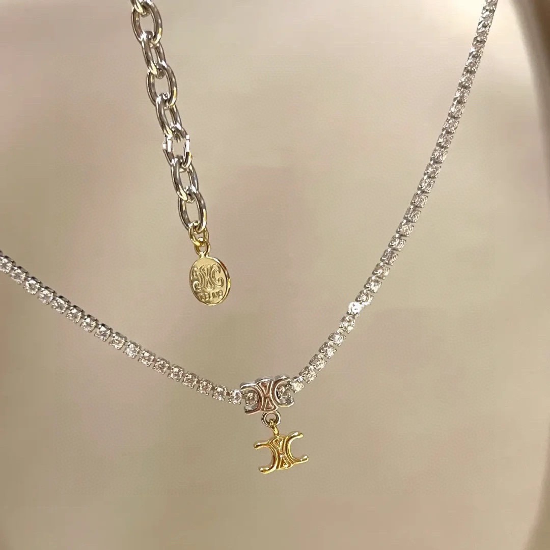 Celine Triomphe necklace silver-toned metal with clear cubic zirconia gold-toned Triomphe charm 38cm