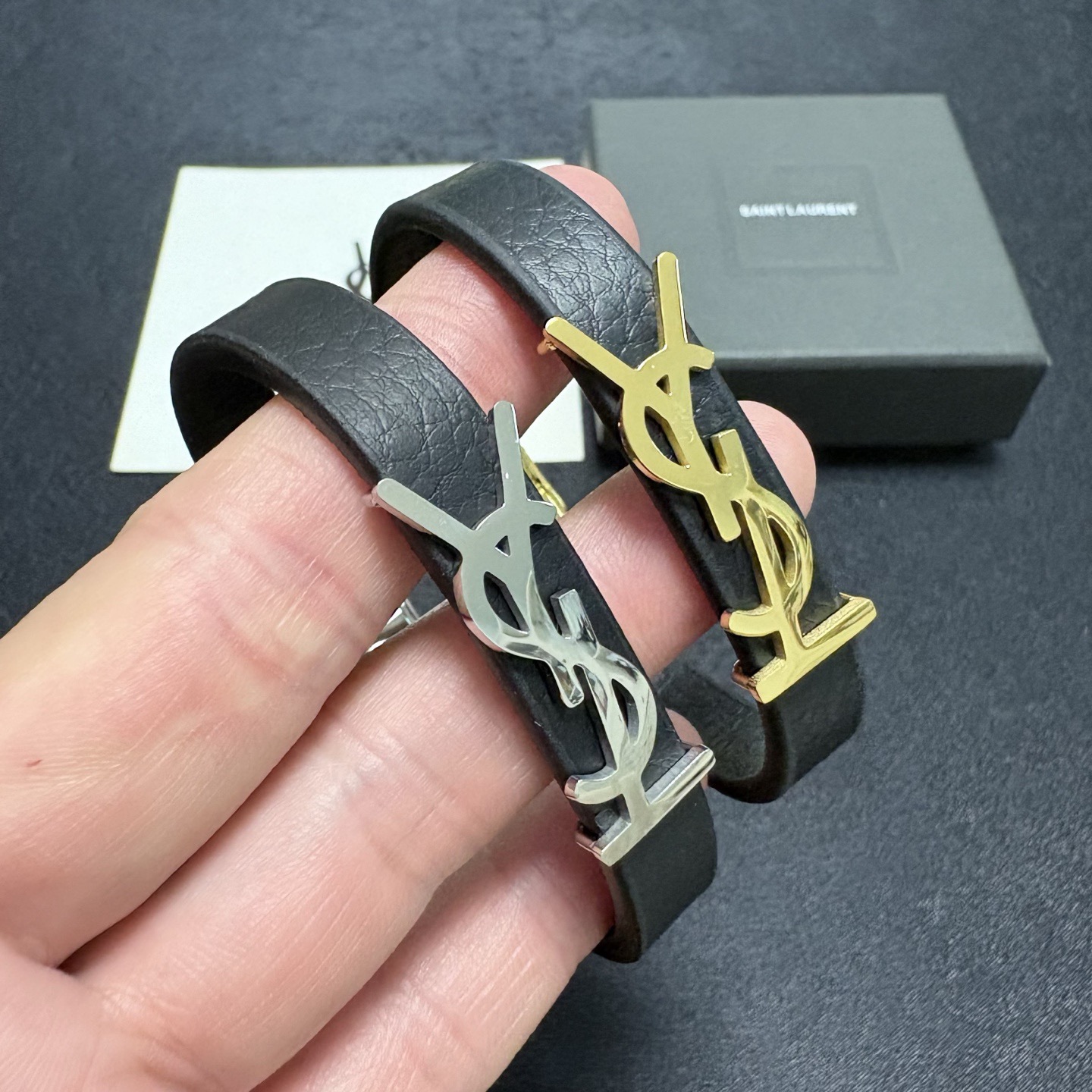 Saint Laurent Cassandre YSL Logo Leather Bracelet bracelet Black grained leather with gold-tone metal hardware 19cm