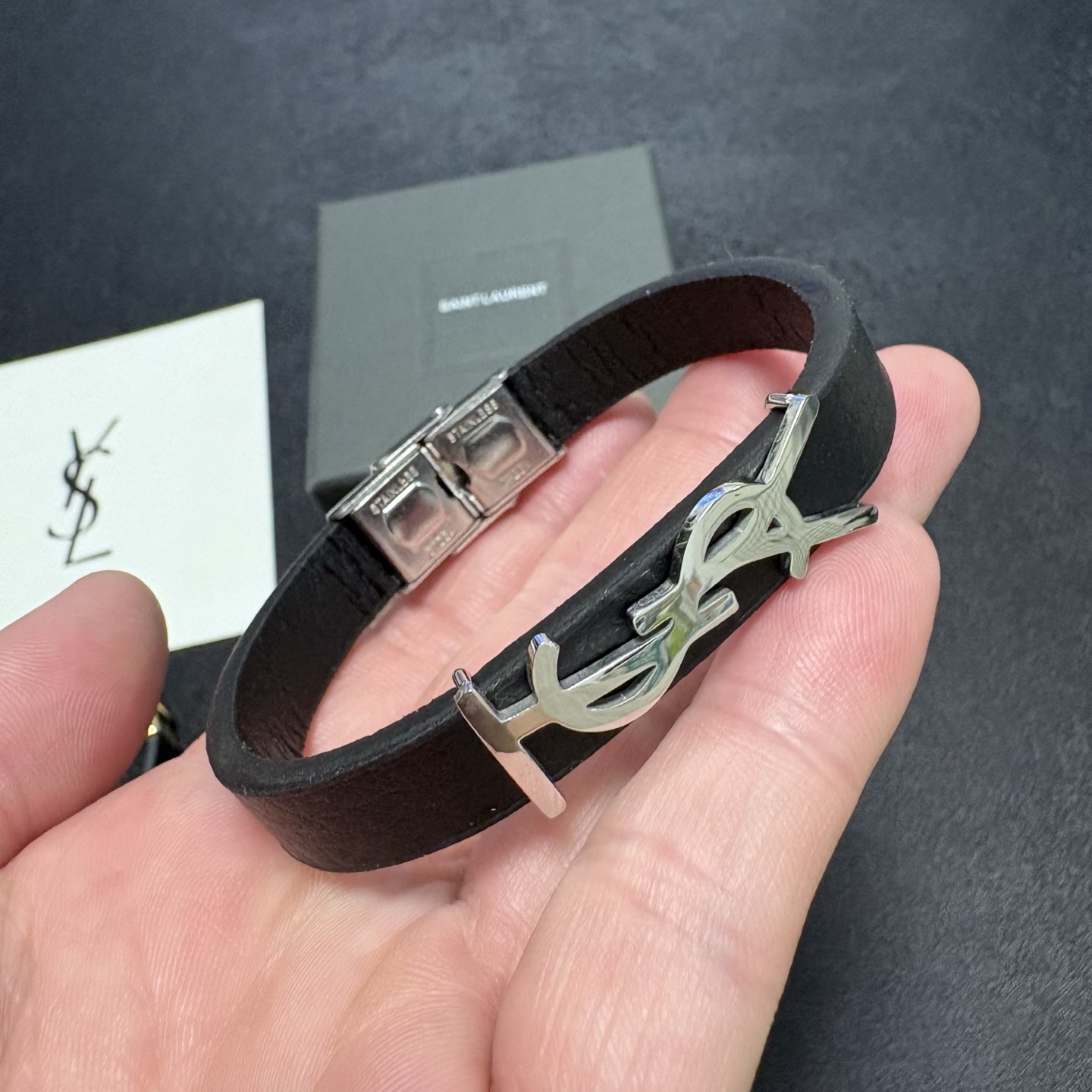 Saint Laurent Cassandre YSL Logo Leather Bracelet bracelet Black grained leather with gold-tone metal hardware 19cm
