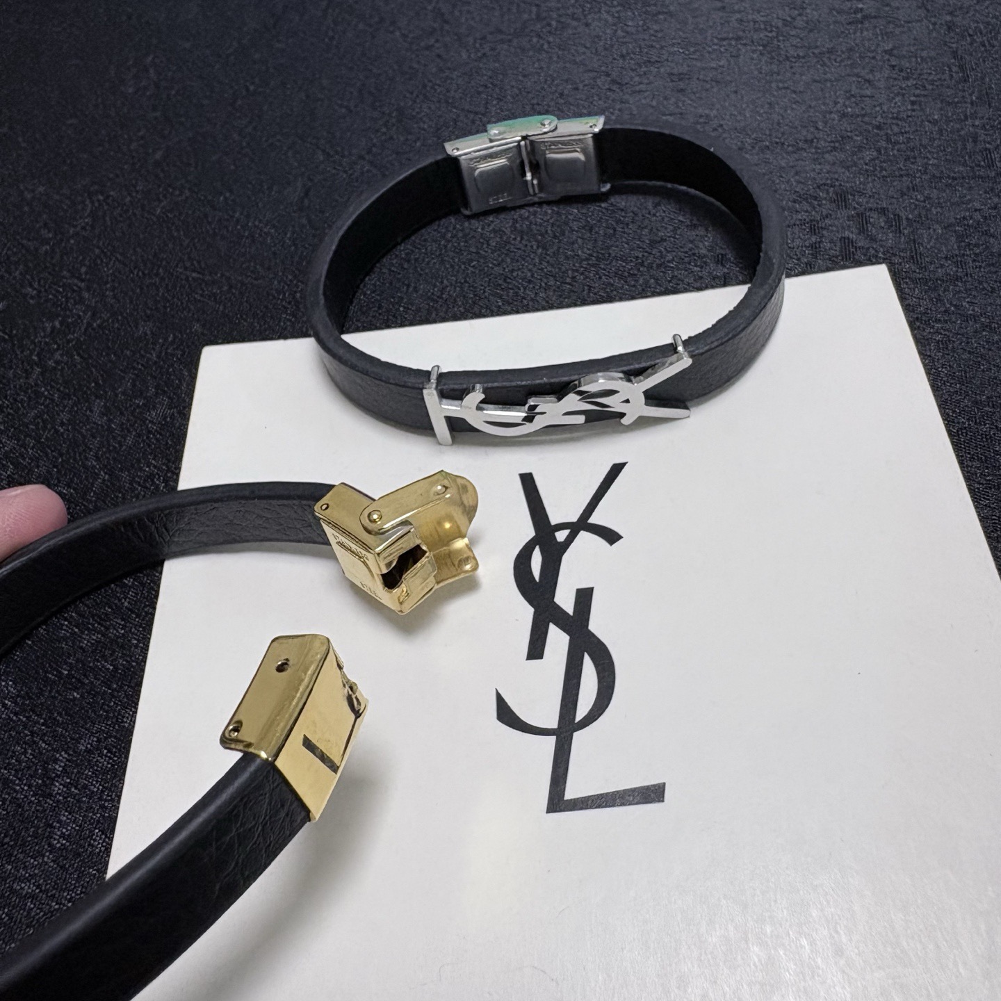 Saint Laurent Cassandre YSL Logo Leather Bracelet bracelet Black grained leather with gold-tone metal hardware 19cm