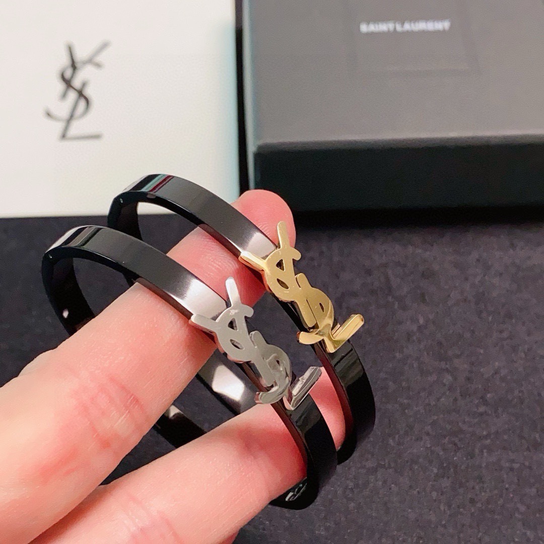 Saint Laurent Cassandre YSL Logo Bangle bracelet Black enamel metal with gold-tone or silver-tone YSL logo hardware 17cm inner circumference