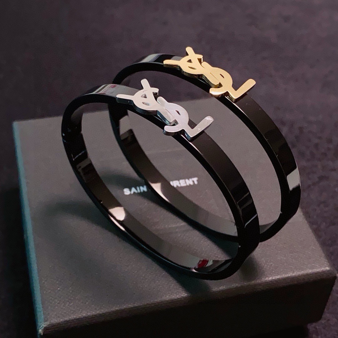 Saint Laurent Cassandre YSL Logo Bangle bracelet Black enamel metal with gold-tone or silver-tone YSL logo hardware 17cm inner circumference