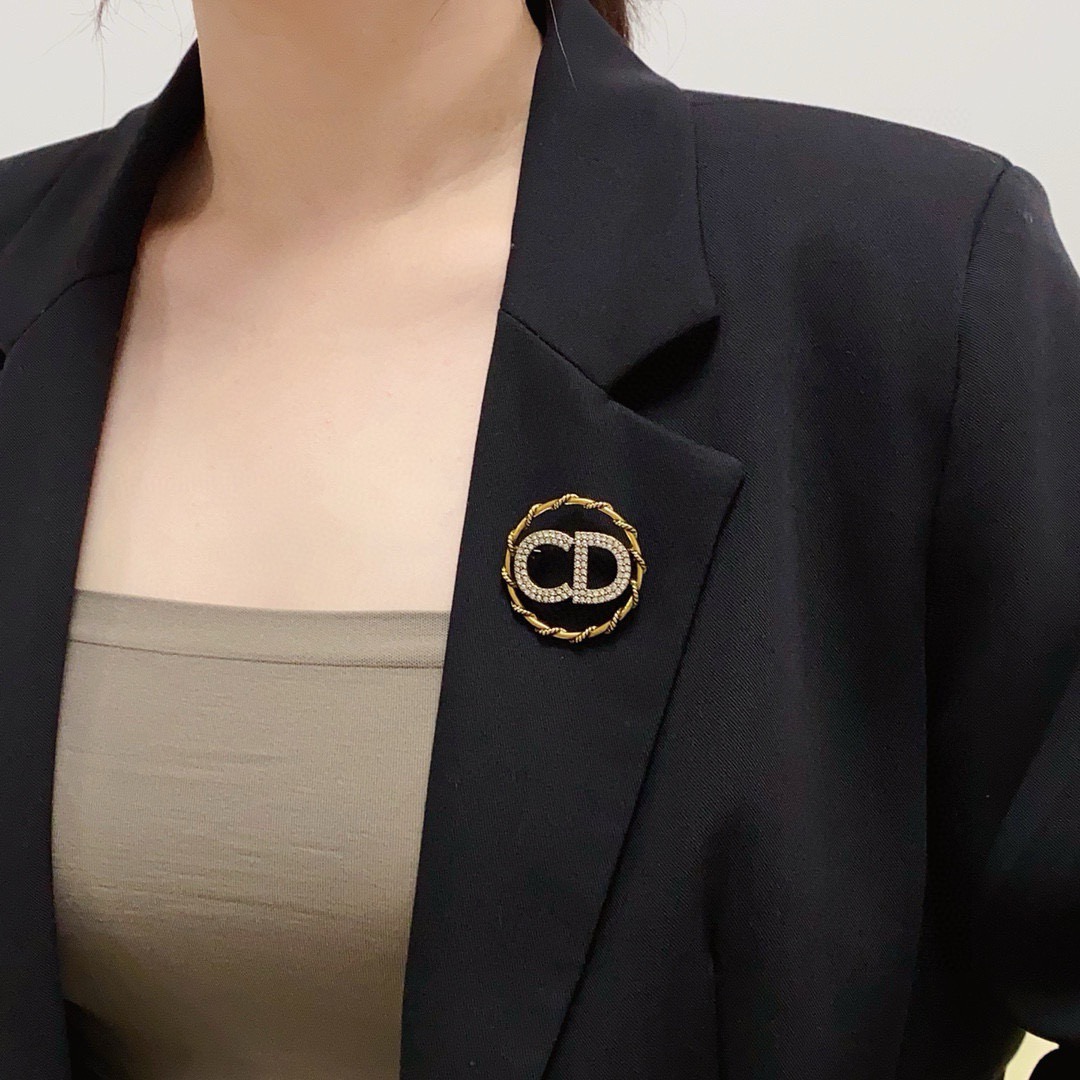 Dior CD Logo D Series brooch gold-tone metal with clear crystal rhinestones 3 2cm diameter