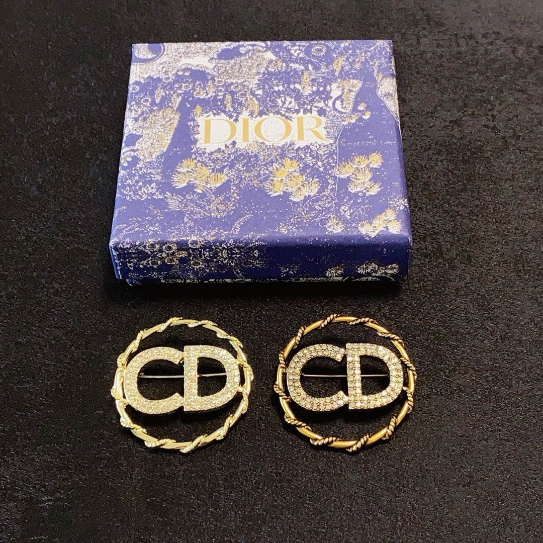 Dior CD Logo D Series brooch gold-tone metal with clear crystal rhinestones 3 2cm diameter