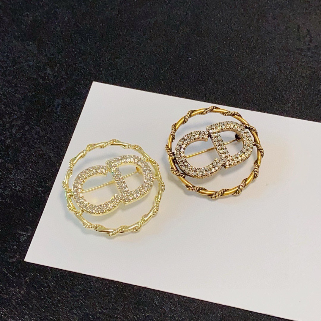 Dior CD Logo D Series brooch gold-tone metal with clear crystal rhinestones 3 2cm diameter