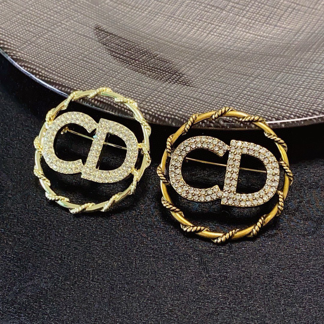 Dior CD Logo D Series brooch gold-tone metal with clear crystal rhinestones 3 2cm diameter
