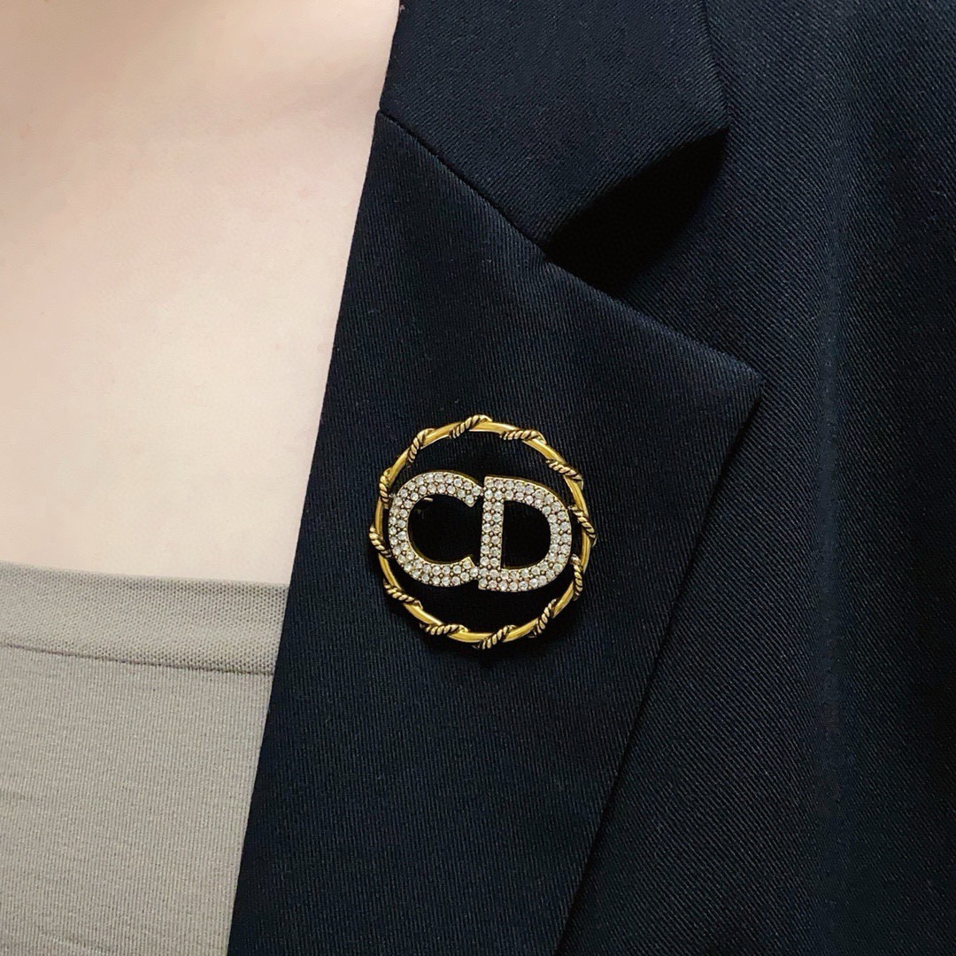 Dior CD Logo D Series brooch gold-tone metal with clear crystal rhinestones 3 2cm diameter