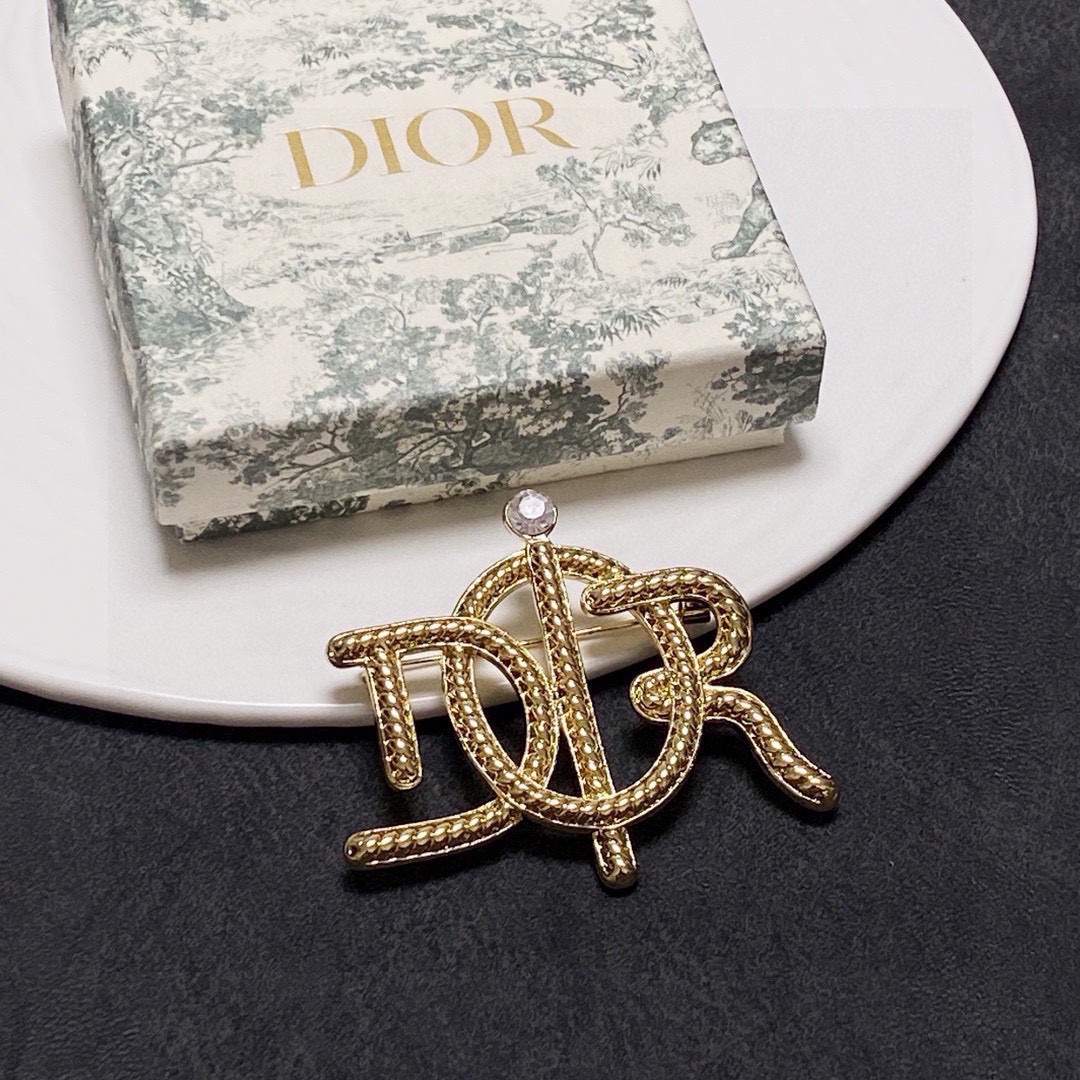 Dior D Series CD Logo Brooch brooch gold-tone metal with clear crystal accent 4cm width