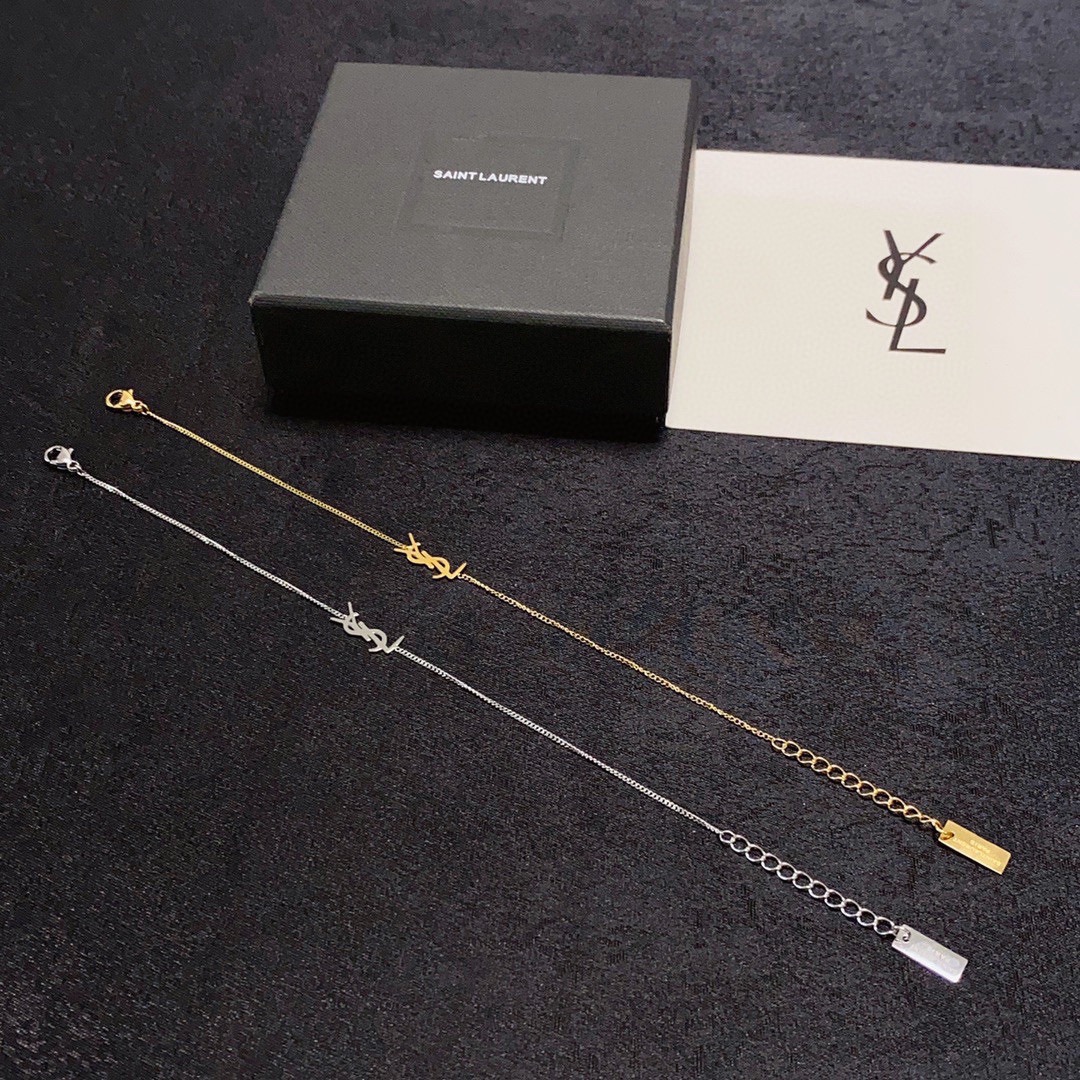 Saint Laurent Cassandre YSL Logo bracelet gold-tone metal no gemstones 16cm with 3cm extender