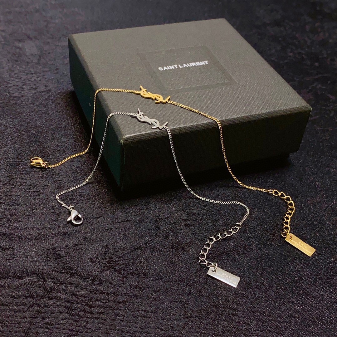 Saint Laurent Cassandre YSL Logo bracelet gold-tone metal no gemstones 16cm with 3cm extender