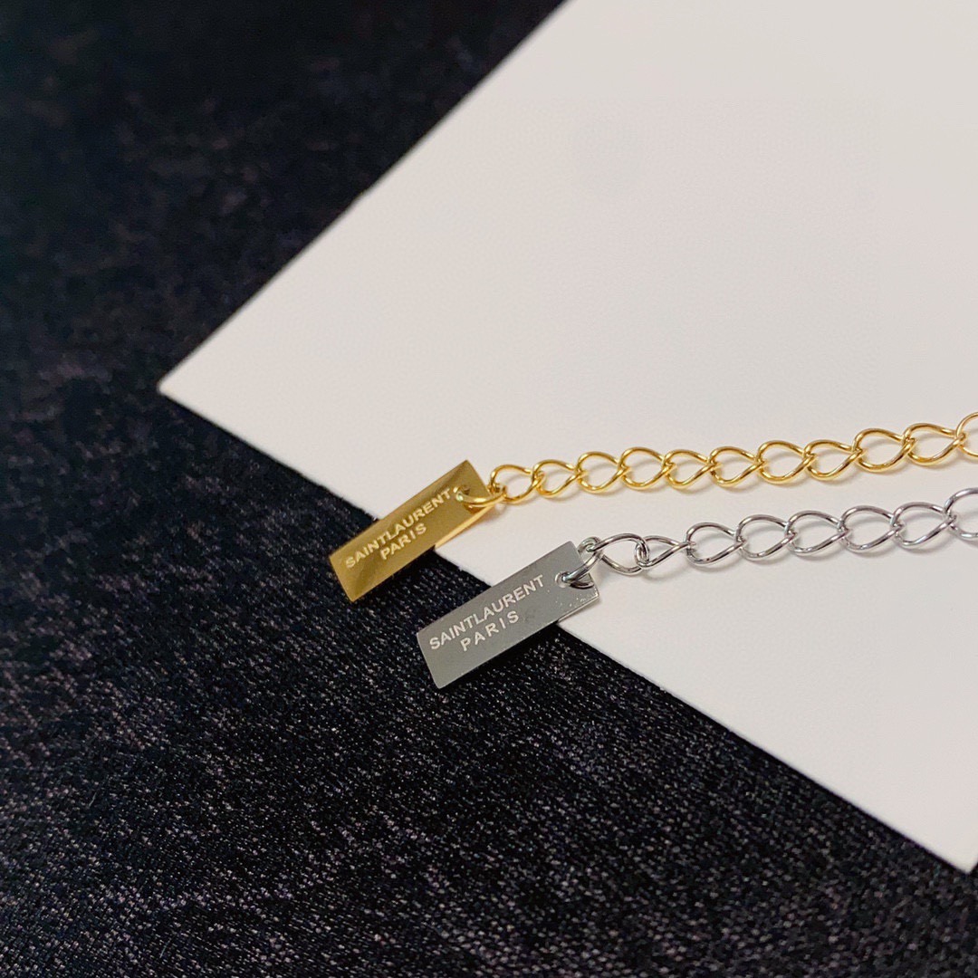Saint Laurent Cassandre YSL Logo bracelet gold-tone metal no gemstones 16cm with 3cm extender