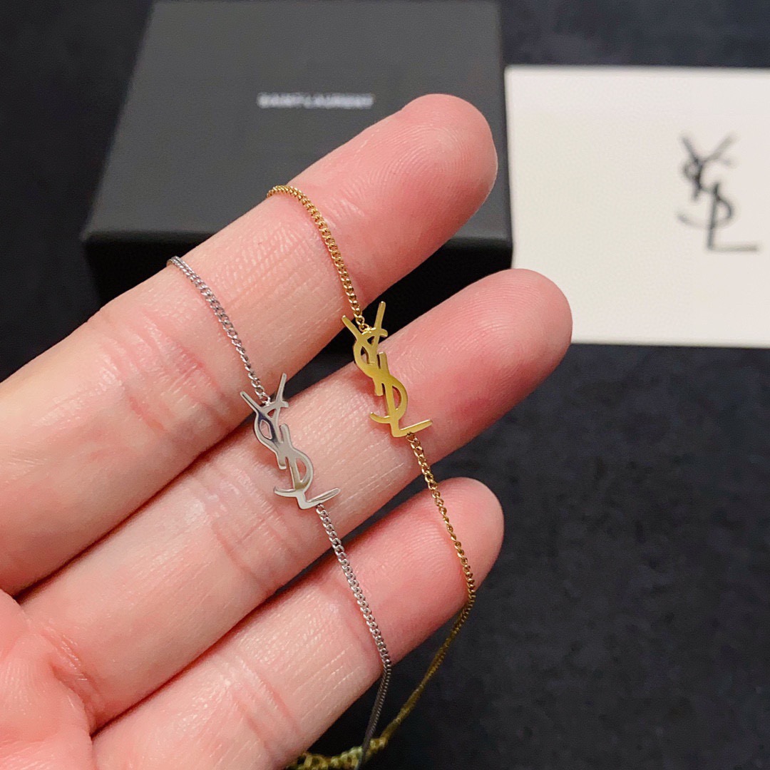 Saint Laurent Cassandre YSL Logo bracelet gold-tone metal no gemstones 16cm with 3cm extender