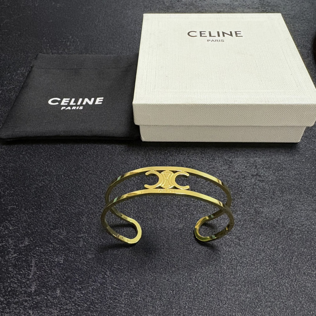 Celine Triomphe Open Cuff bracelet Gold-tone metal no accent stones Adjustable open cuff fits 15-18cm wrist