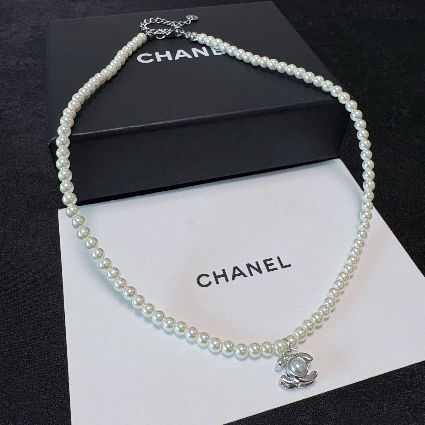 Chanel CC Turnlock Pearl Pendant necklace Gold-tone metal with white faux pearls 40cm
