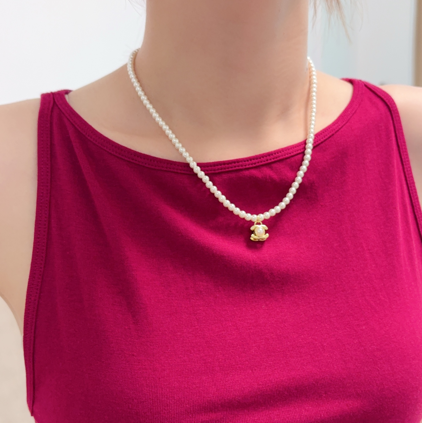 Chanel CC Turnlock Pearl Pendant necklace Gold-tone metal with white faux pearls 40cm