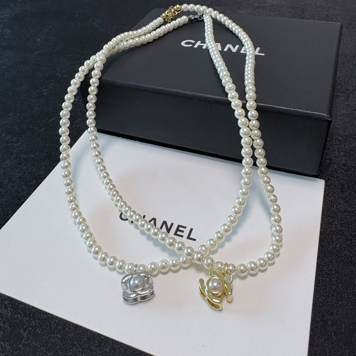 Chanel CC Turnlock Pearl Pendant necklace Gold-tone metal with white faux pearls 40cm