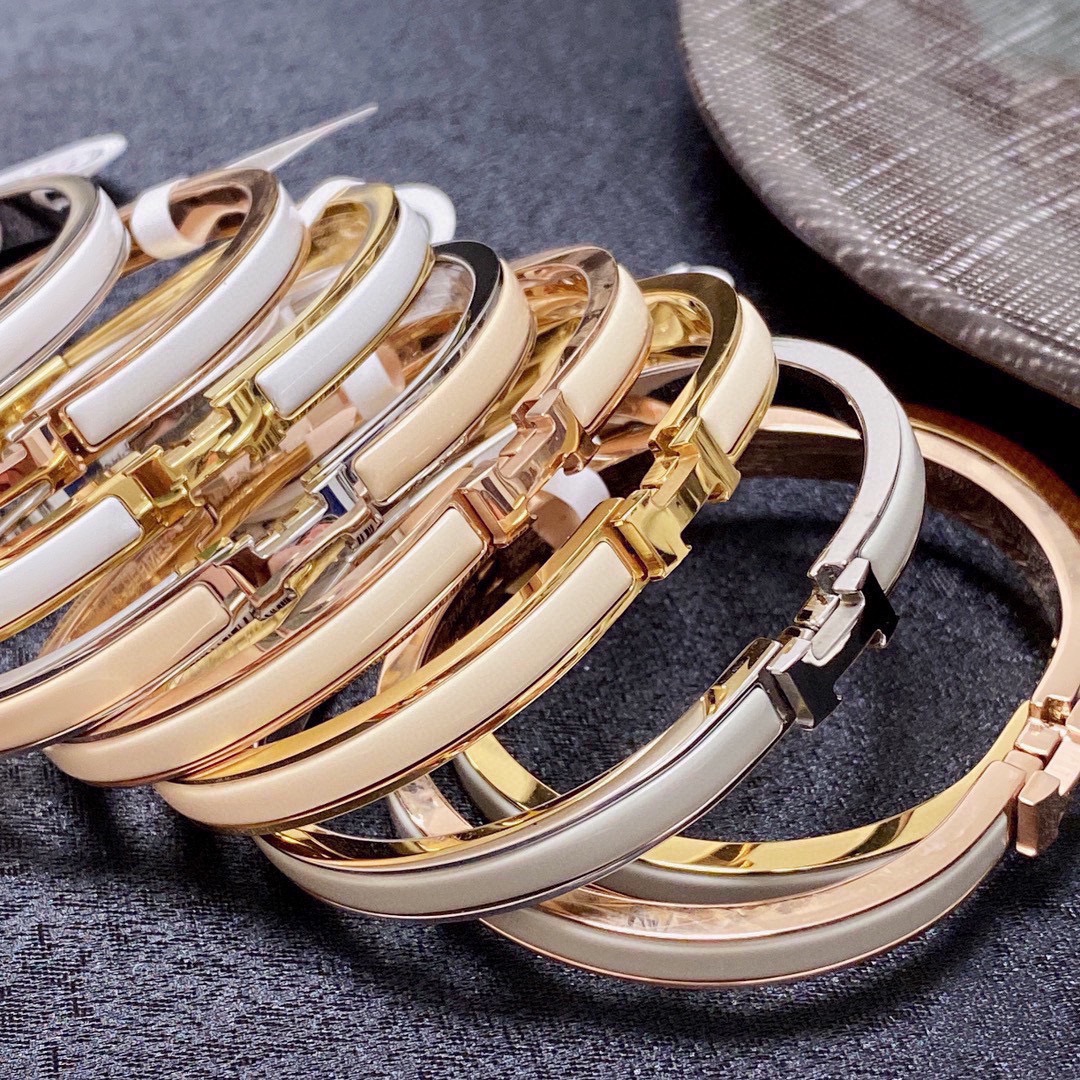 Bracciale Hermes Clic H metallo oro rosa con smalto bianco MM