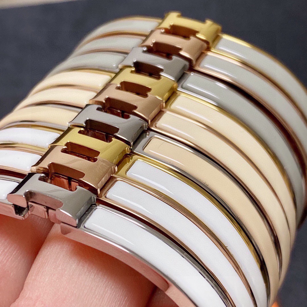 Bracciale Hermes Clic H metallo oro rosa con smalto bianco MM