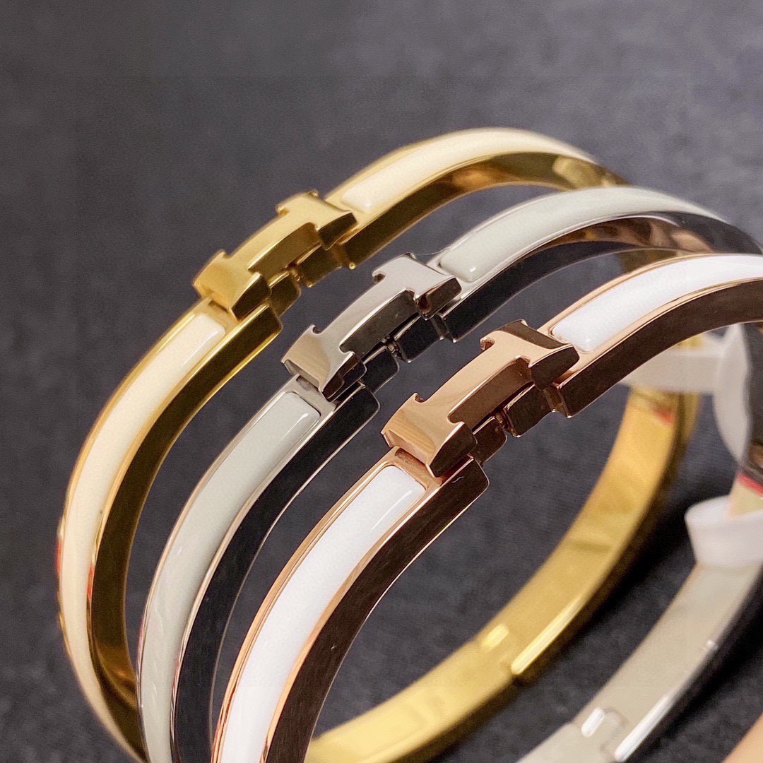 Bracciale Hermes Clic H metallo oro rosa con smalto bianco MM