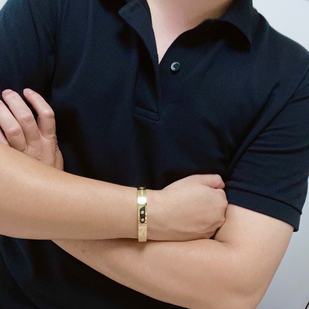 Cartier Love C de Cartier Decor Motif Bangle bracelet Multiple colorways silver-tone with black and red accents black with gold accents blue with gold accents rose gold-tone with black accents yellow gold-tone with black accents all with polished metal finishes and black enamel decorative details 21cm