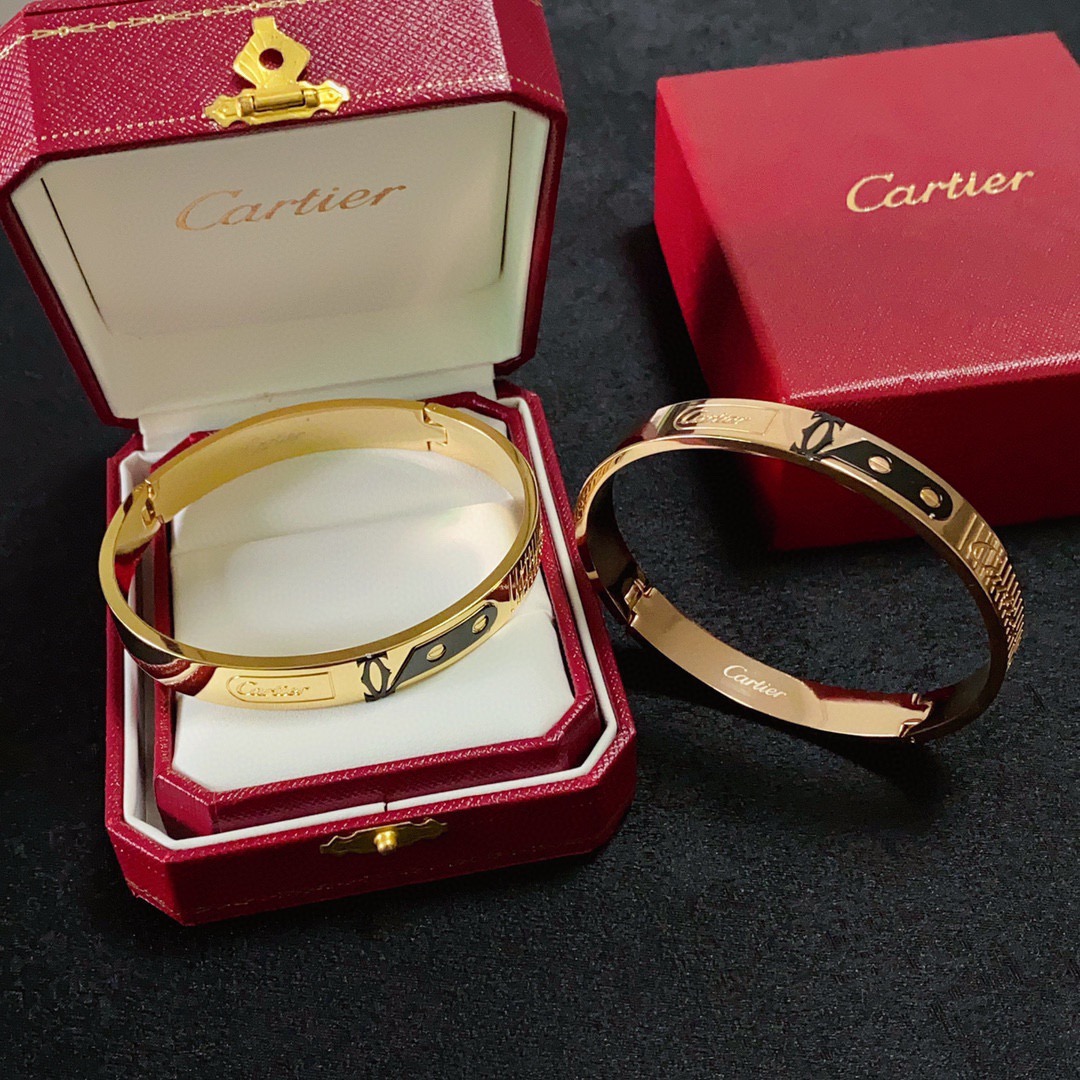 Cartier Love C de Cartier Decor Motif Bangle bracelet Multiple colorways silver-tone with black and red accents black with gold accents blue with gold accents rose gold-tone with black accents yellow gold-tone with black accents all with polished metal finishes and black enamel decorative details 21cm