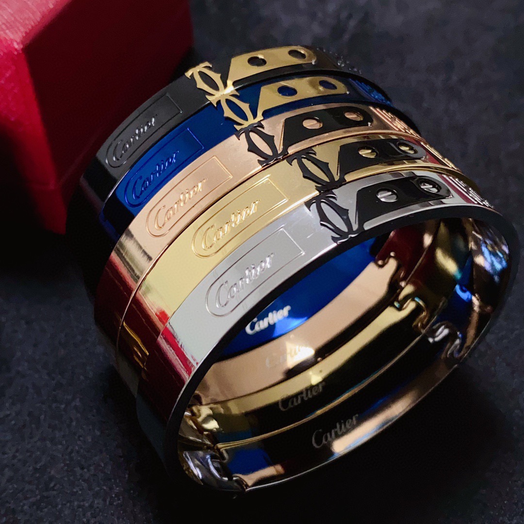 Cartier Love C de Cartier Decor Motif Bangle bracelet Multiple colorways silver-tone with black and red accents black with gold accents blue with gold accents rose gold-tone with black accents yellow gold-tone with black accents all with polished metal finishes and black enamel decorative details 21cm