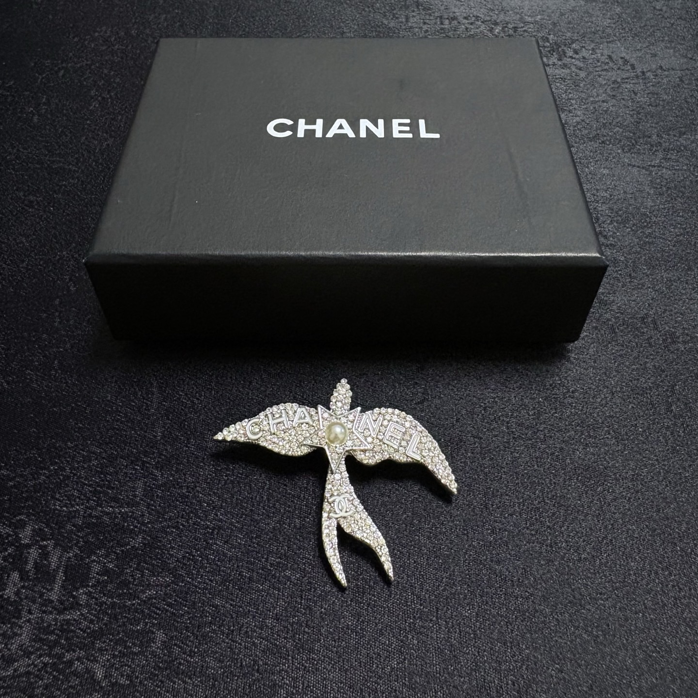 Chanel Crystal Pearl Swallow CC Logo Brooch brooch Silver-toned metal clear crystal white pearl Approximately 4 5cm width x 4cm height