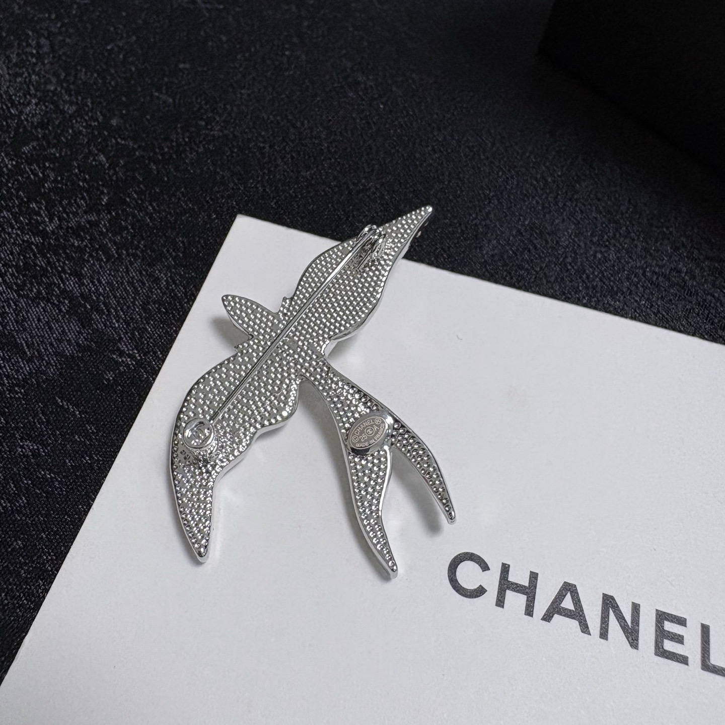 Chanel Crystal Pearl Swallow CC Logo Brooch brooch Silver-toned metal clear crystal white pearl Approximately 4 5cm width x 4cm height