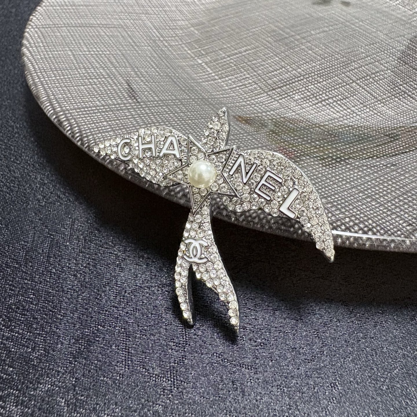 Chanel Crystal Pearl Swallow CC Logo Brooch brooch Silver-toned metal clear crystal white pearl Approximately 4 5cm width x 4cm height