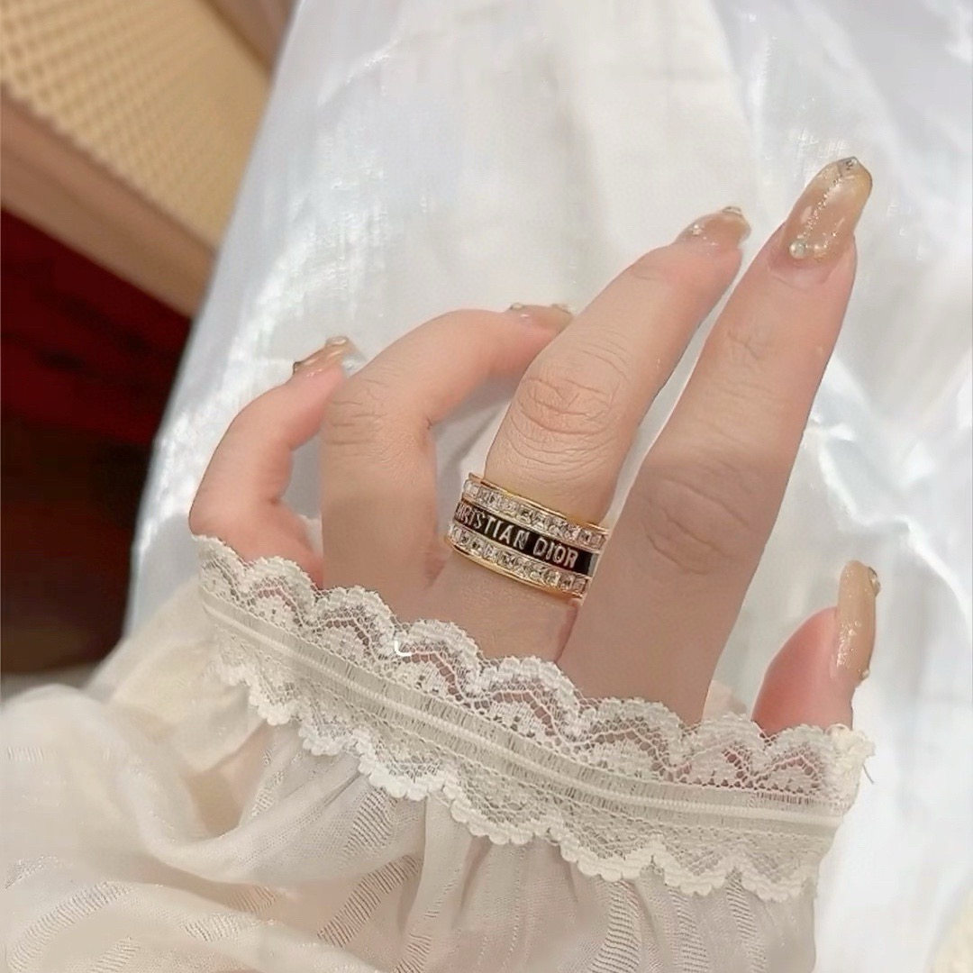Dior Night Code ring gold-tone metal with clear crystals available with white enamel or black enamel logo band 6 7 8