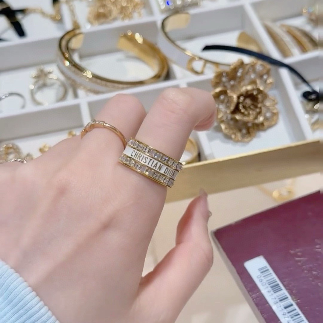 Dior Night Code ring gold-tone metal with clear crystals available with white enamel or black enamel logo band 6 7 8