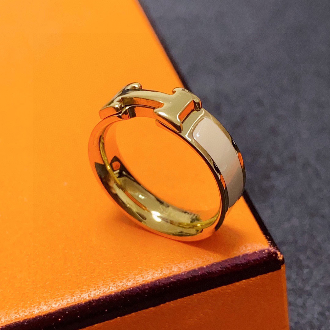 Anello Hermes Clic H in metallo dorato con smalto crema 7