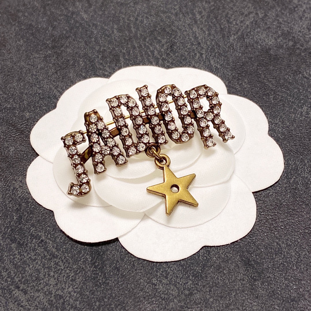 Dior J Adior brooch antique gold tone metal with clear crystal accents and gold star charm 4cm width