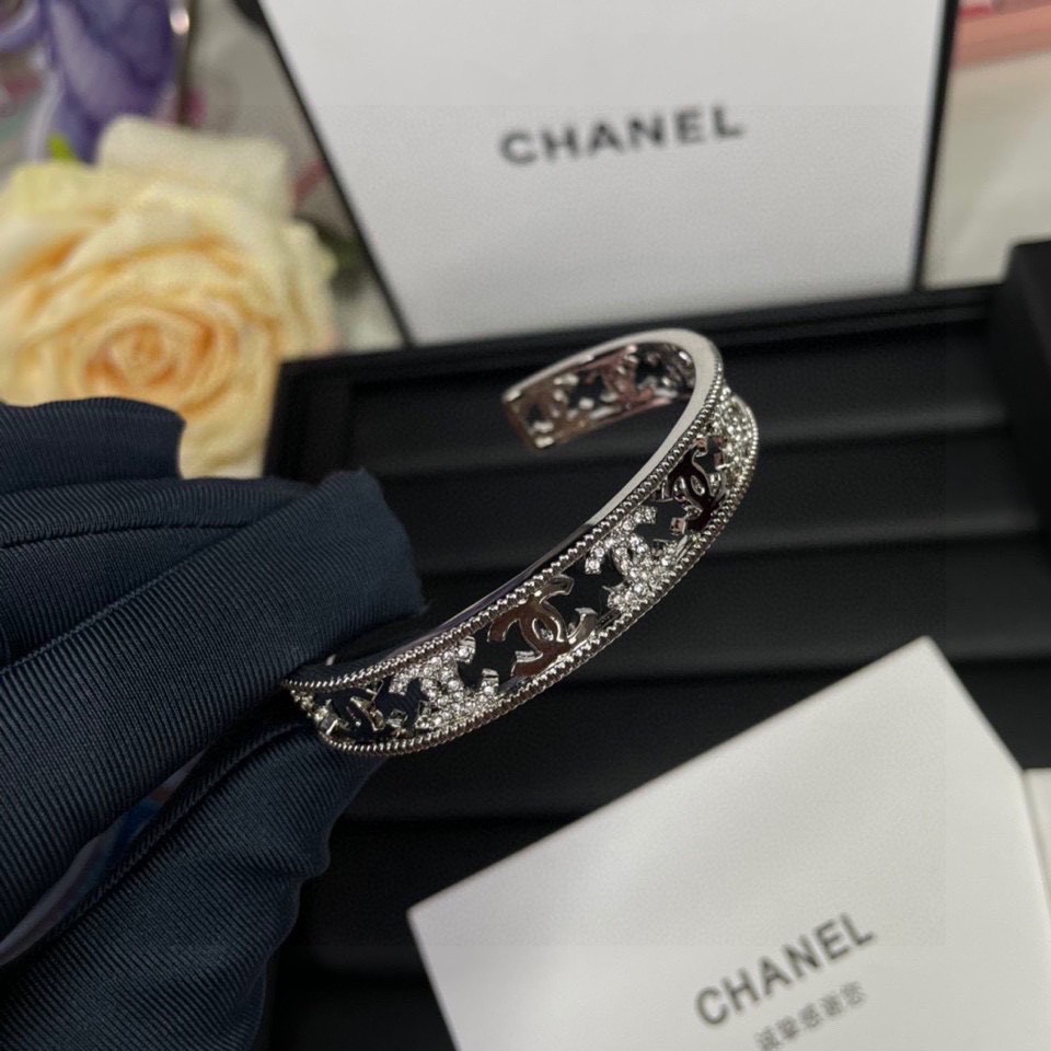 Chanel CC Logo Cutout Crystal Cuff bracelet silver-toned metal with clear crystal accents 17cm inner circumference