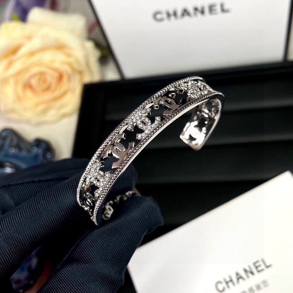 Chanel CC Logo Cutout Crystal Cuff bracelet silver-toned metal with clear crystal accents 17cm inner circumference