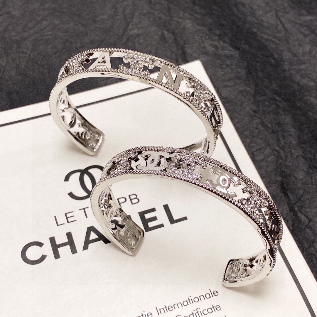 Chanel CC Logo Cutout Crystal Cuff bracelet silver-toned metal with clear crystal accents 17cm inner circumference