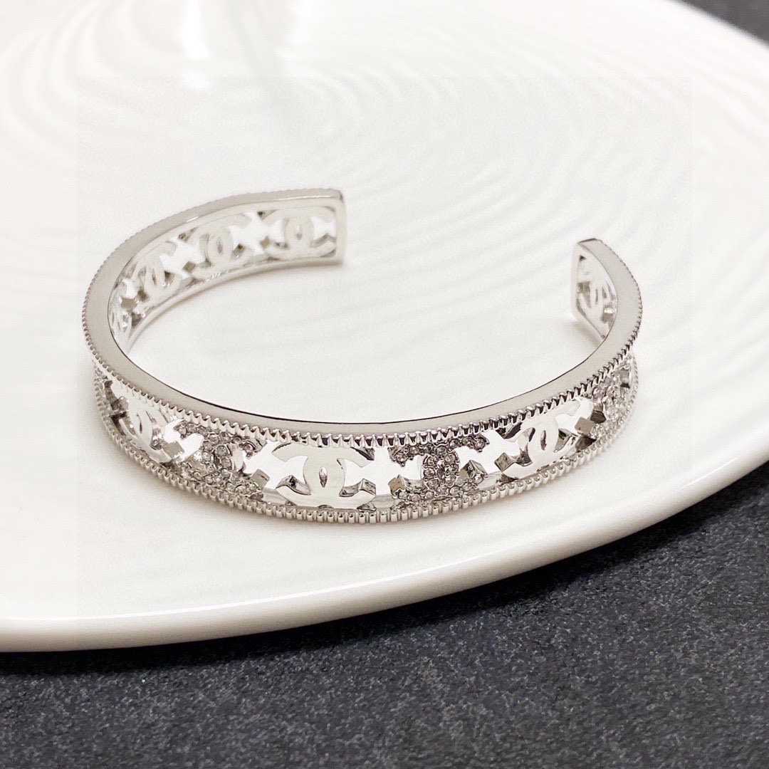 Chanel CC Logo Cutout Crystal Cuff bracelet silver-toned metal with clear crystal accents 17cm inner circumference