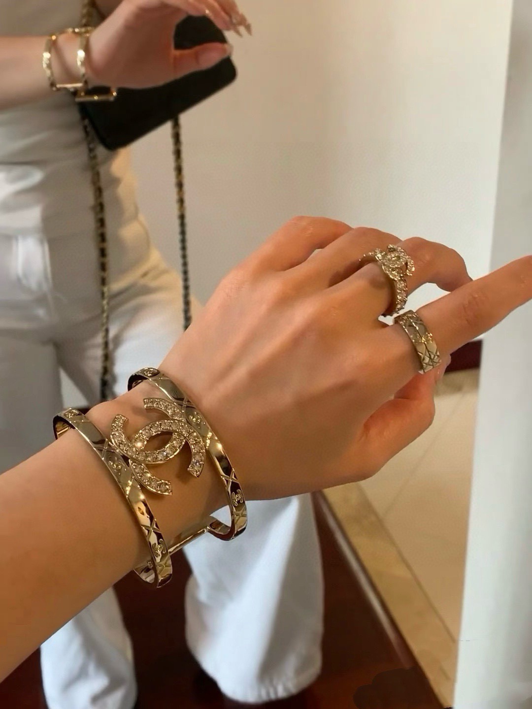 Chanel CC Logo Quilted Crystal Cuff bracelet gold-tone metal with clear crystal accents 17cm inner circumference