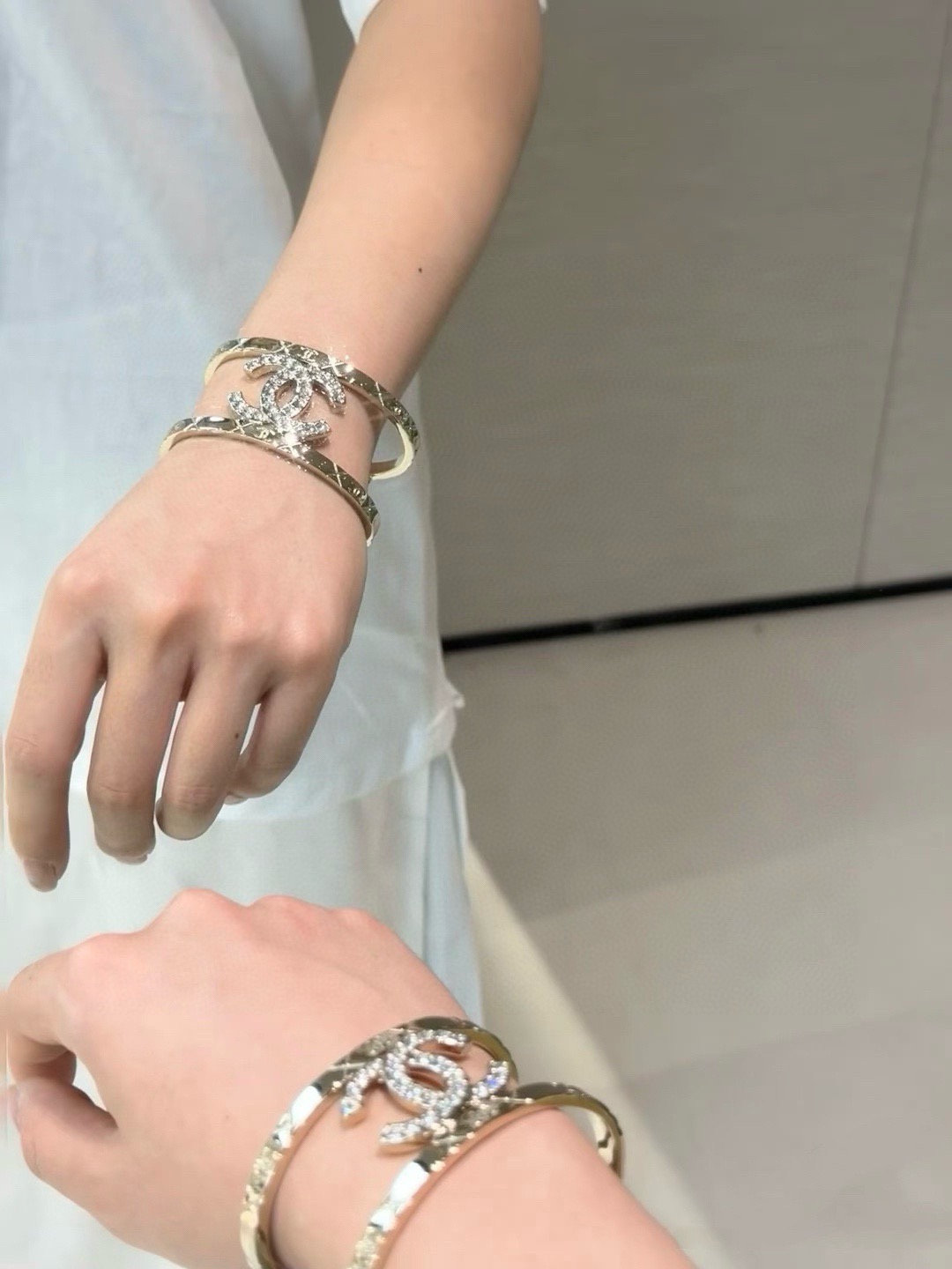 Chanel CC Logo Quilted Crystal Cuff bracelet gold-tone metal with clear crystal accents 17cm inner circumference