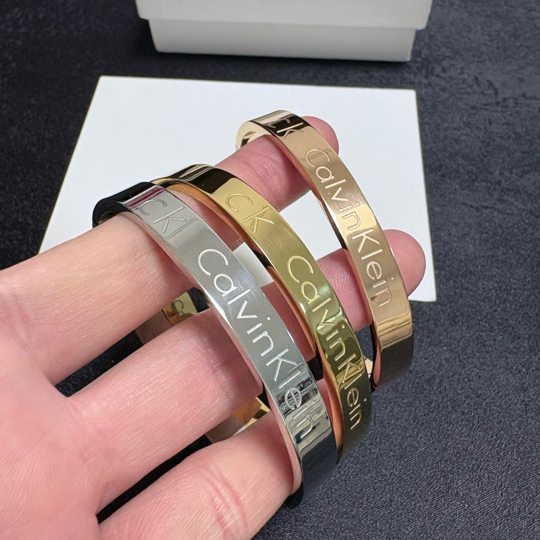 Calvin Klein CK Logo Engraved Bangle bracelet Silver Gold Rose Gold polished metal no gemstones 19cm