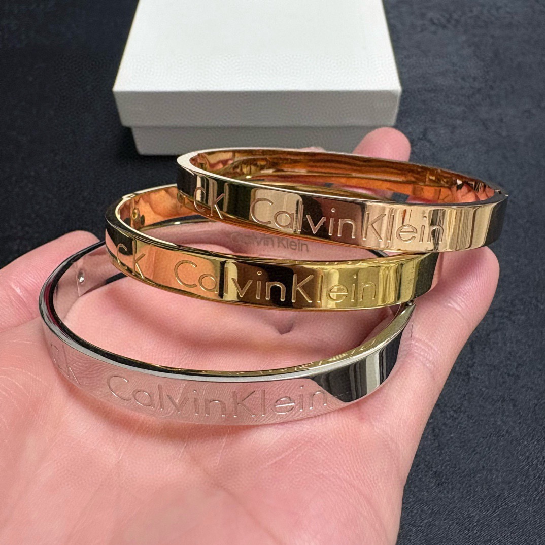 Calvin Klein CK Logo Engraved Bangle bracelet Silver Gold Rose Gold polished metal no gemstones 19cm