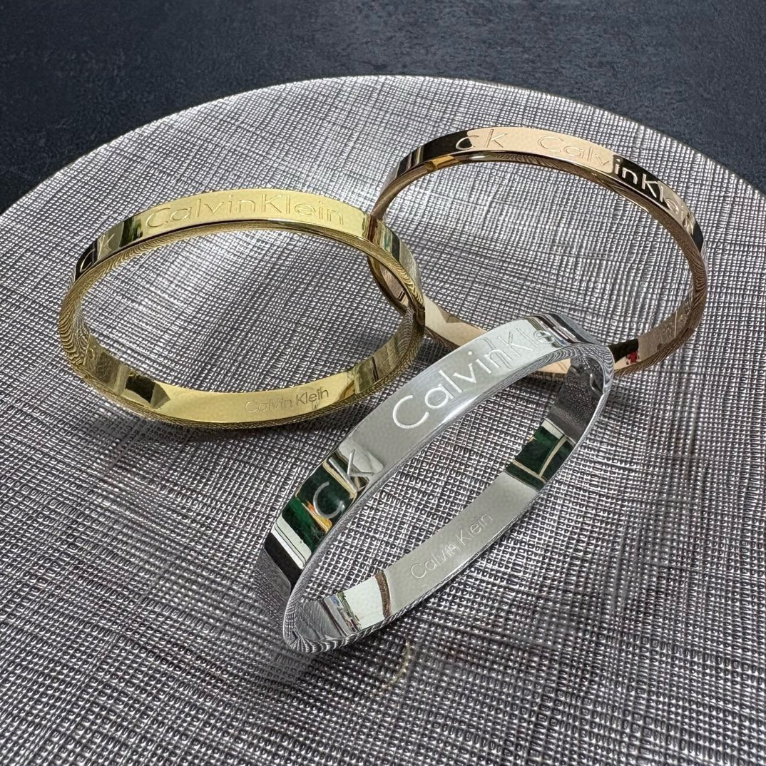 Calvin Klein CK Logo Engraved Bangle bracelet Silver Gold Rose Gold polished metal no gemstones 19cm