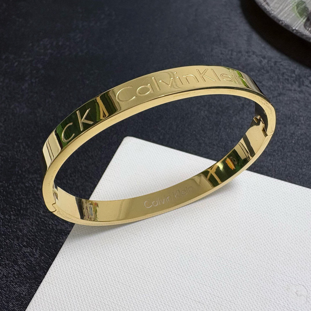 Calvin Klein CK Logo Engraved Bangle bracelet Silver Gold Rose Gold polished metal no gemstones 19cm